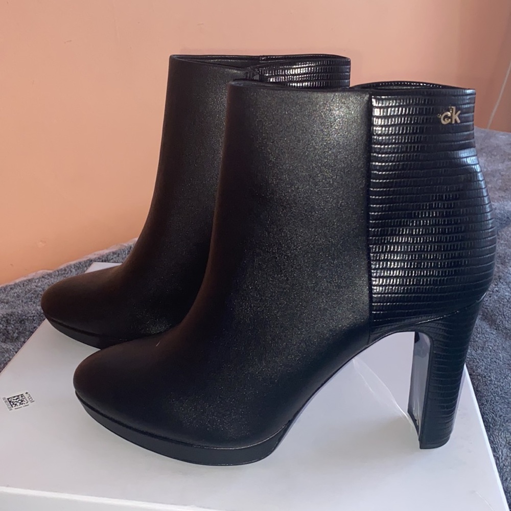 Black Calvin Klein heeled booties. Size 10